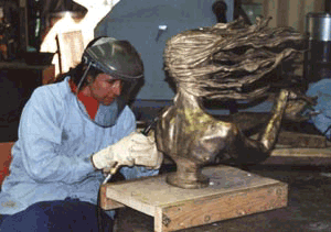 Metal chasing a bronze sculpture
